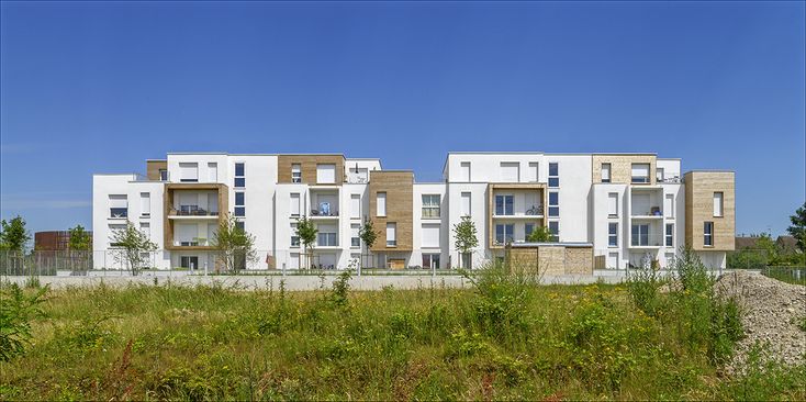 an apartment building with multiple balconies and windows