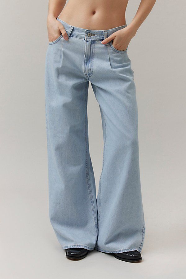 Vintage-inspired Dad jeans from Levi’s® with a perfectly broken-in feel. Cut in a mid-rise silhouette with a slouchy straight leg that puddles at the hem. Features Levi’s® dad jeans a mid-rise and a loose and relaxed wide-leg Crafted from rigid denim that will soften over time Logo patch at the back Zip fly Content + Care 100% Cotton Machine wash Imported Size + Fit Mid rise Wide leg Full length Model in Light Blue is 5’8" and wearing size 27 Measurements taken from size 28 Rise: 10.5" Inseam: 32" Leg opening: 26" | Levi's Novel Baggy Dad Jean in Light Blue, Women's at Urban Outfitters Levis Baggy, Wide Leg Outfit, Time Logo, Dad Jeans, Long Jeans, Blue Fits, Slim Fit Jeans, Clothing And Shoes, Womens Bottoms