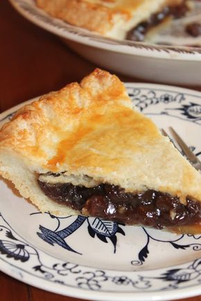 a piece of pie sitting on top of a blue and white plate