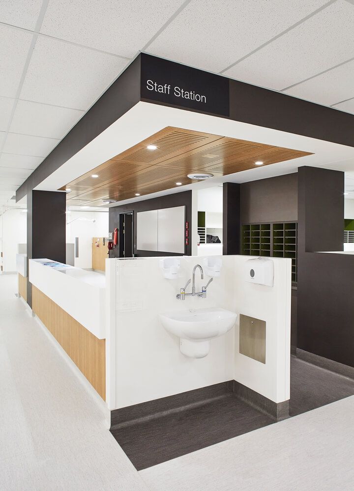 a white sink sitting inside of a bathroom next to a counter