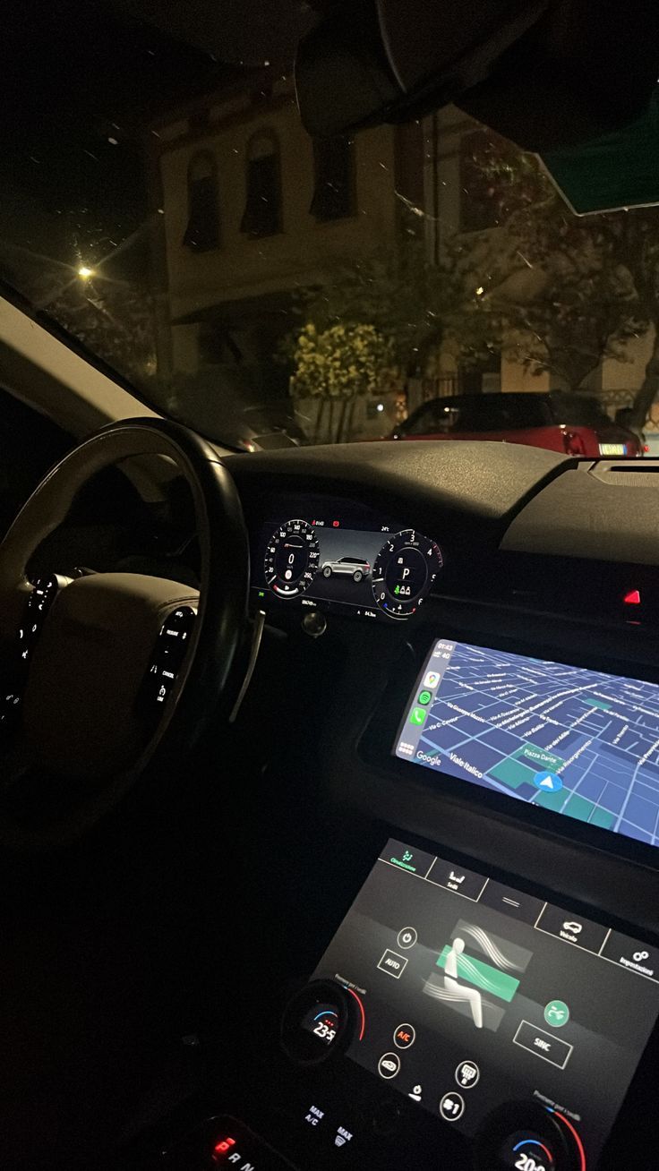 the dashboard of a car with an electronic display on it's screen and steering wheel