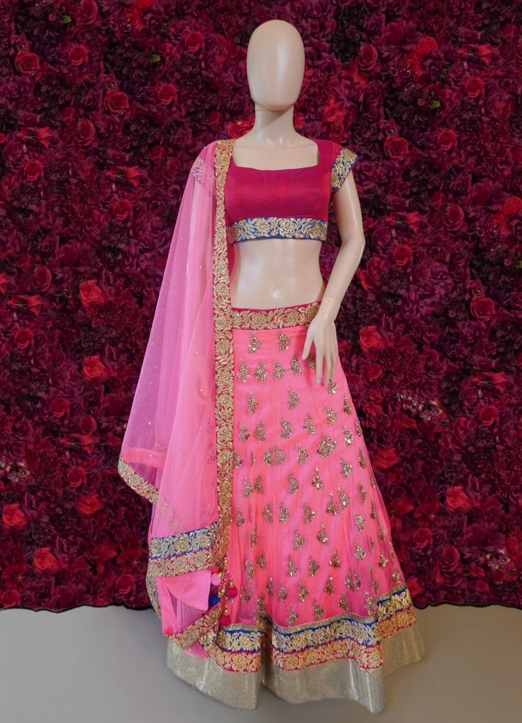 Go all out in this whimsical lehenga, studded with precious mirror, pearl, stone, embroidery work, which is sure to bring out the innate grace and grandeur in you! Color - Mauvelous Pink Fabric & Work Style - - Silk blouse: mirror, pearl, stone, embroidery work. - Soft net lehenga: mirror, pearl, stone, embroidery work. - Soft net dupatta: embroidery work. Details - - Assured quality - Wash care instruction: Dry clean only. - Slight variation in color is possible due to digital photography. Bollywood Style Embellished Traditional Wear In Raw Silk, Designer Embellished Raw Silk Choli, Embellished Raw Silk Choli For Designer Wear, Raw Silk Lehenga With Mirror Work For Reception, Embellished Raw Silk Choli For Wedding, Wedding Choli In Embellished Raw Silk, Festive Embellished Art Silk Choli, Kundan Choli For Reception And Diwali, Wedding Embellished Raw Silk Choli