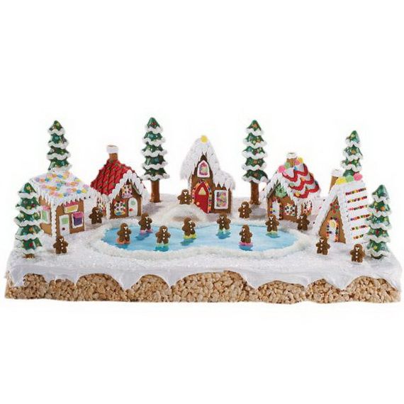 a christmas scene with gingerbread houses and snow covered trees in front of a pond