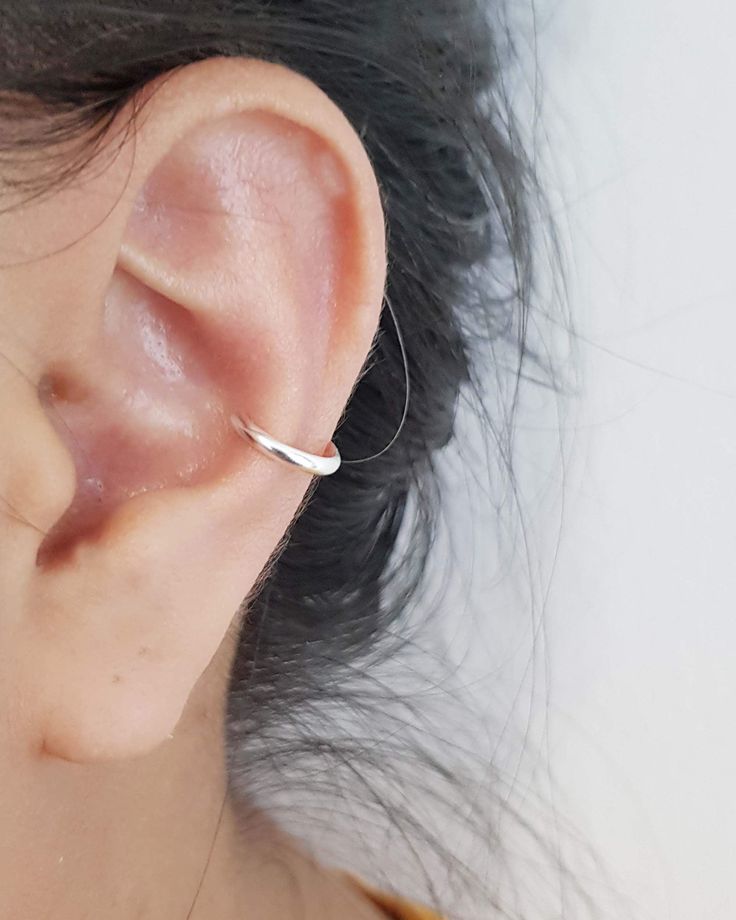 A Pair of Real 925 Sterling Silver Minimalist Ear Cuff Are you looking for simple yet elegant earrings? These pair of ear cuffs are right for you! The ear cuffs minimalist design is timeless and compliment any style without overpowering it. Adjustable ear cuffs for every occasion. Size: 10mm (adjustable) Material: 925 Sterling Silver MY SHOP: https://www.etsy.com/shop/TLJewelleryCreations PROCESS TIME I ship all orders 1-3 days from date of order PACKAGING All orders will be beautifully packaged Minimalist Ear Cuff, Ear Cuff Earrings, Silver Ear Cuff, Ear Cuff Earings, Ear Cuffs, Everyday Earrings, Cuff Earrings, Elegant Earrings, Pierced Ears