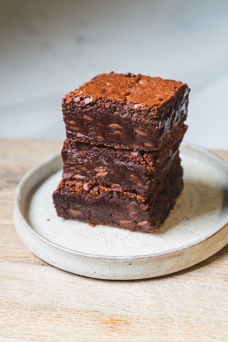 three brownies stacked on top of each other on a plate