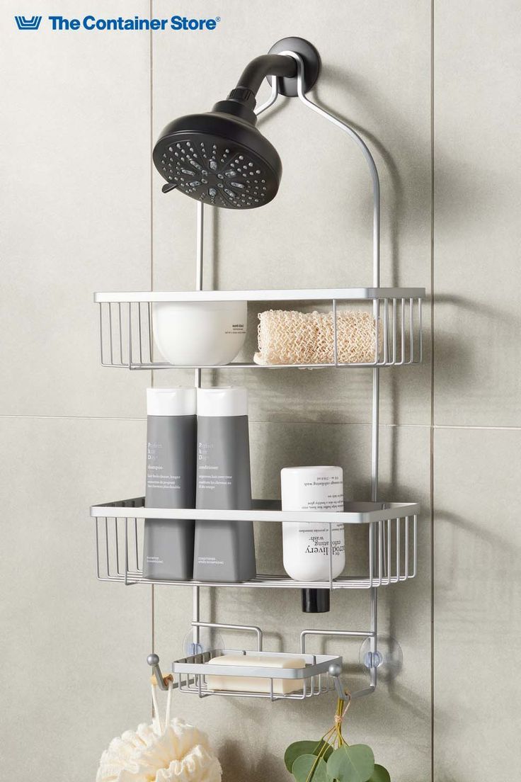 a bathroom shelf with two shelves holding soap, shampoos and other hygiene products