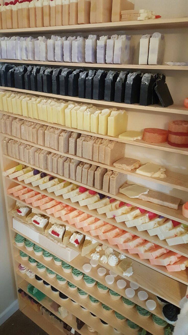 the shelves are filled with different types of desserts