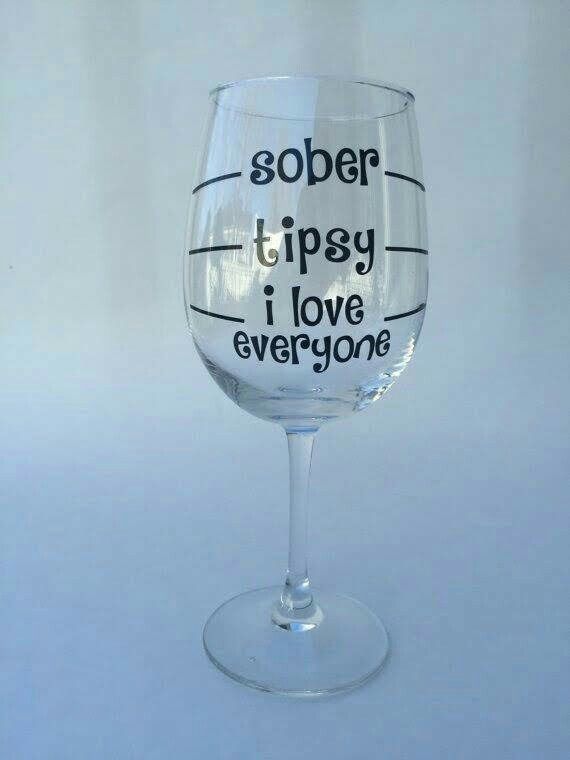 a wine glass that has some writing on it