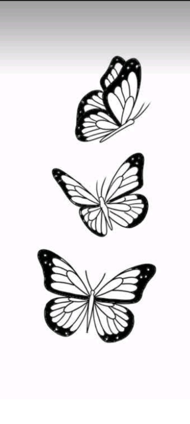 three black and white butterflies flying in the air