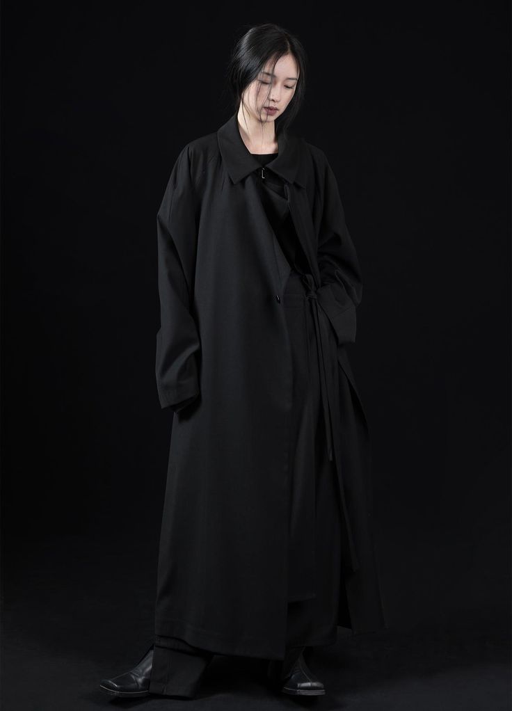 Versatile Wave Collar Overcoat - Detachable wave-inspired collar overcoat in black. This unisex piece can be worn around the waist for a fitted look or as a full-body oversized fit. Asian formal design crafted from a polyester and cotton blend. Available in sizes XS, S, M, and L. Models Pei (165cm/43kg) and Pang (180cm/60kg) both wear Medium. VAPOUR BLUE's unique production process requires 3-5 additional business days for shipping. Size Chart: Size (cm) Length Shoulder Chest Sleeve Extra Small Black Oversized Long Outerwear, Black Long Oversized Outerwear, Oversized Long Black Outerwear, Black Avant-garde Long Sleeve Outerwear, Avant-garde Black Long Sleeve Outerwear, Avant-garde Black Outerwear For Work, Black Oversized Avant-garde Outerwear, Oversized Black Avant-garde Outerwear, Formal Design