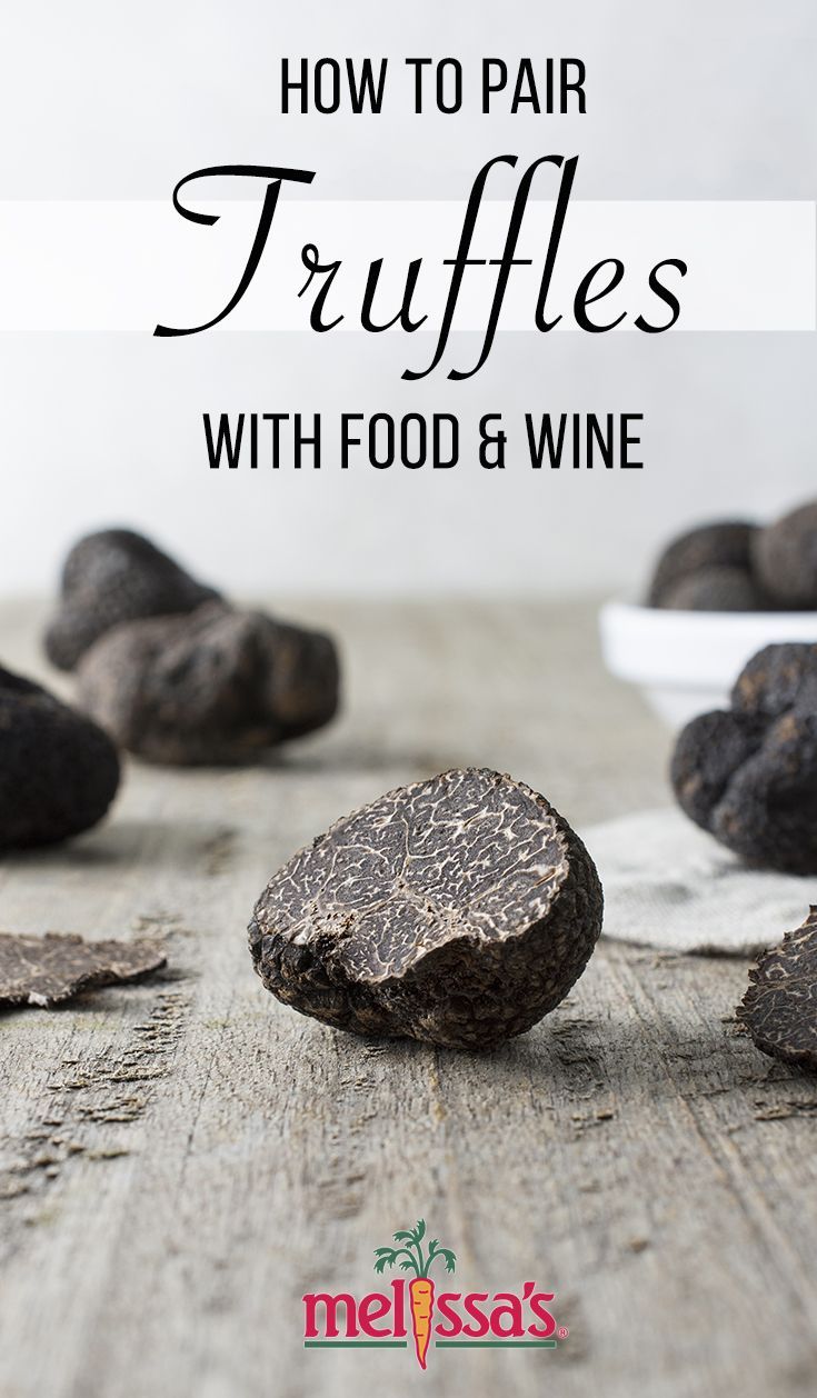 black truffles on a wooden table with text overlay reading how to pair truffles with food & wine