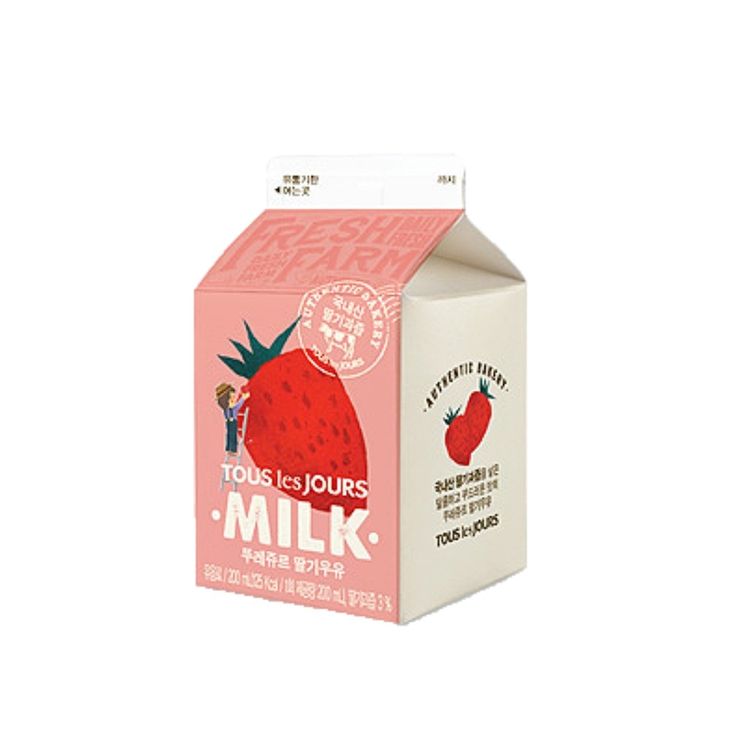 a carton of milk with a strawberry on it