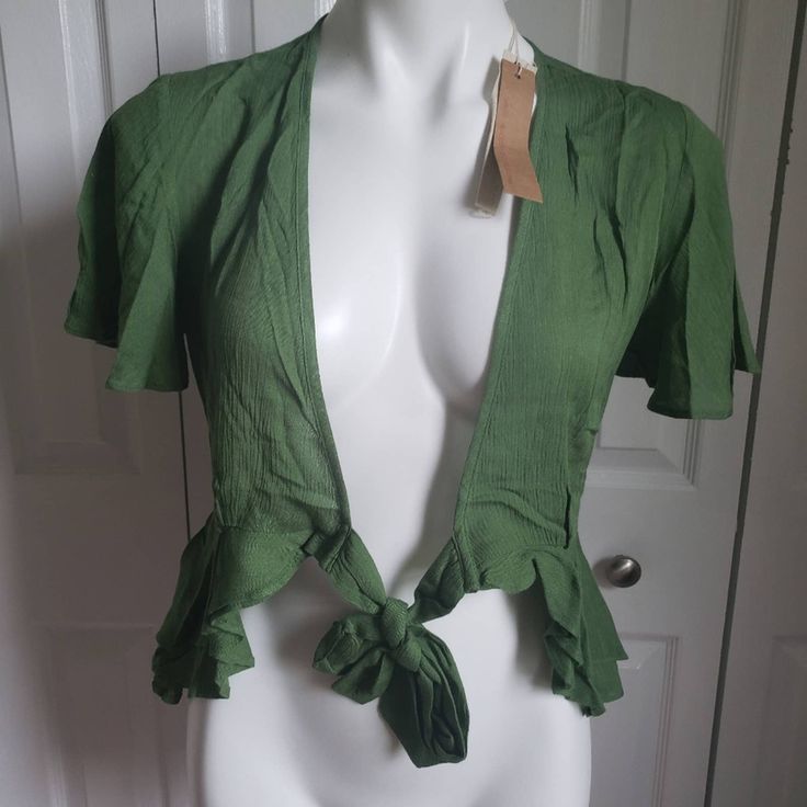 Mustard Seed Green Short Sleeve Open Cardigan Nwt Ties In Front. Flutter Short Sleeve. Gorgeous Green Color. Size Small. New With Tags. Wear To Work Or With Jeans Or A Casual Dress! Can Be Styled For All Seasons! Shipping From A Smoke Free, Dog Friendly Home. Summer V-neck Shrug, Chic V-neck Shrug For Spring, Fitted Casual Spring Shrug, Chic V-neck Shrug For Summer, Fitted V-neck Shrug For Spring, Chic V-neck Summer Shrug, Fitted Green Cardigan For Summer, Chic Open Front Cotton Top, Spring Cotton Fitted Shrug