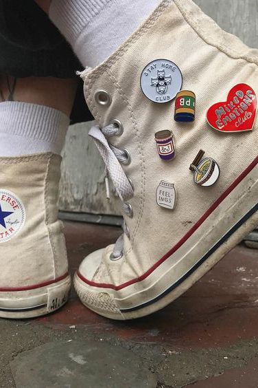 a person's shoes with buttons on them