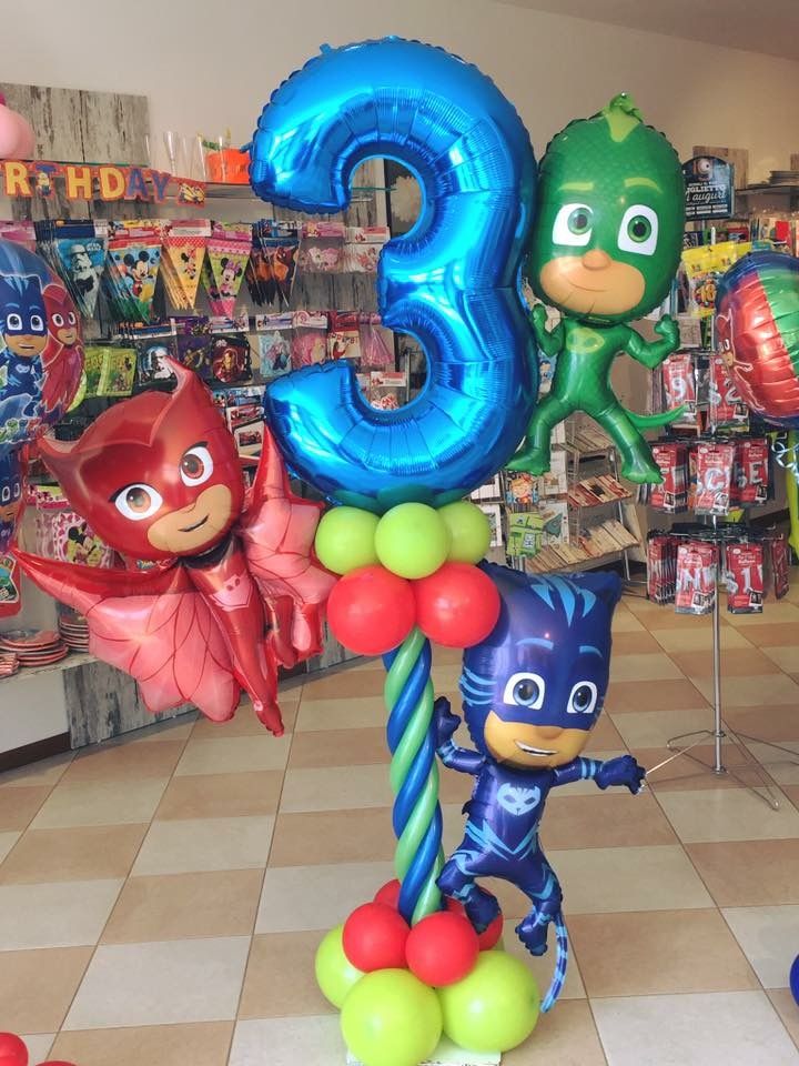 some balloons that are in the shape of numbers for children's birthdays at a toy store