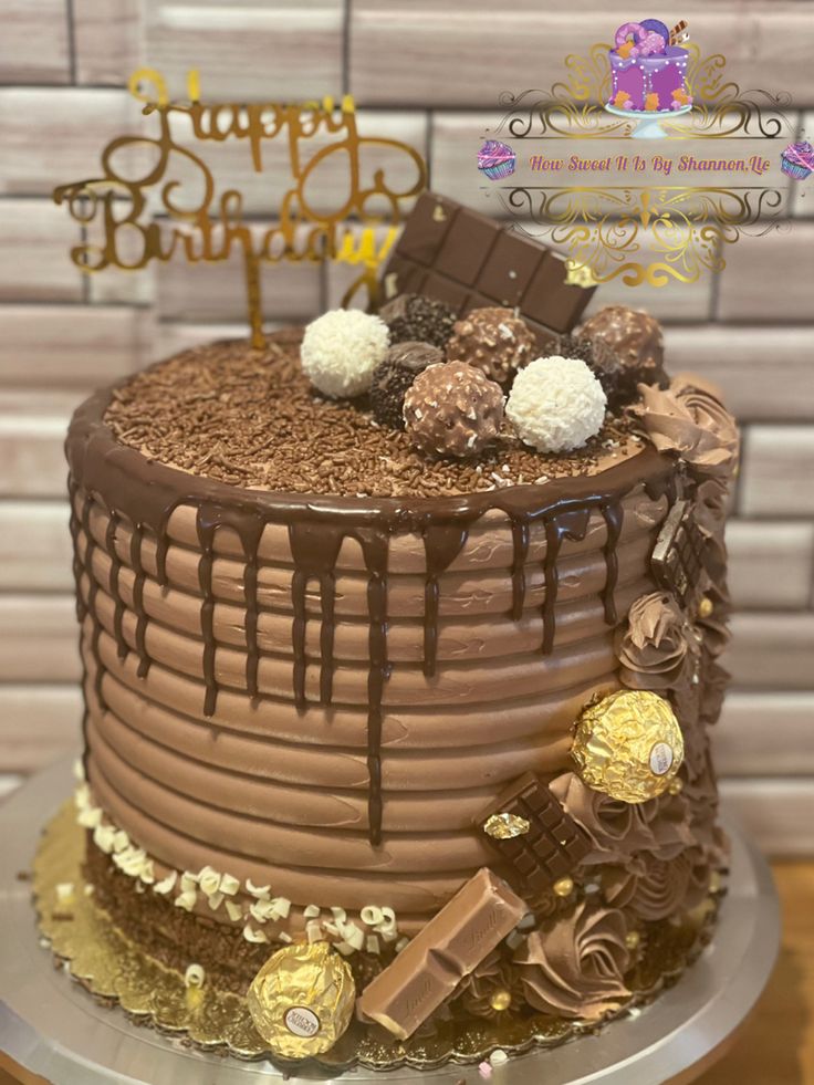 a birthday cake with chocolate frosting and decorations