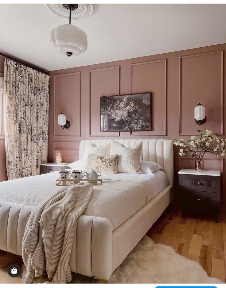 an instagram photo of a bedroom with pink walls and wood paneling, white bedspread, beige bedding