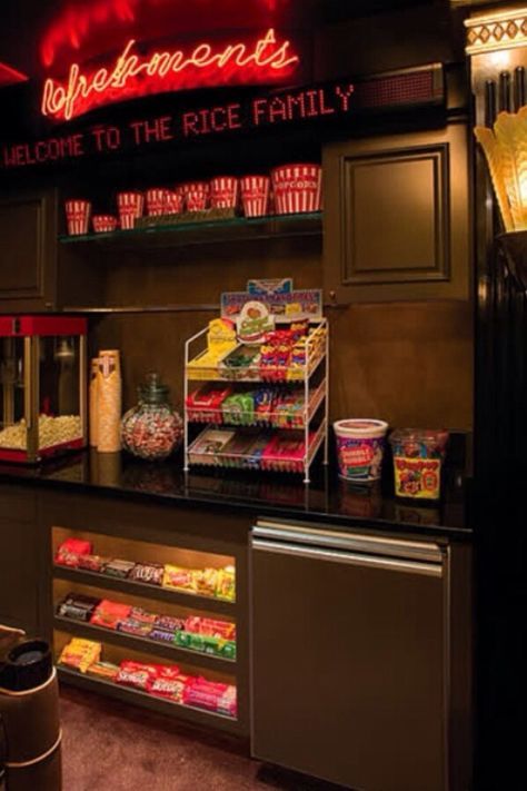 the interior of a fast food restaurant with neon signs above it and snacks on display