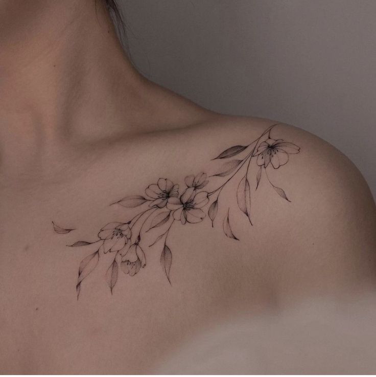 a woman's chest with flowers on it