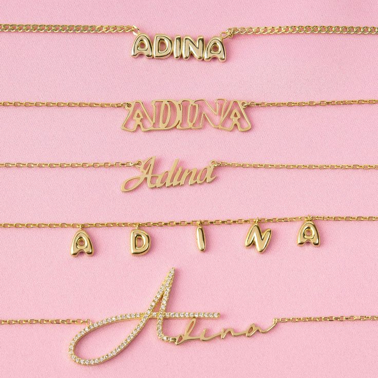 Presenting the Adina Eden Solid Bubble Name Link Necklace, a stunning addition to your jewelry collection that effortlessly combines style and personalization. Crafted from sterling silver and luxuriously gold plated, this necklace exudes elegance and sophistication. The nameplate, standing at a height of 7mm, ensures that your chosen name or word is showcased prominently. The sleek Cuban chain design, with a thickness of 2mm, offers both durability and comfort, while the adjustable length of 15 Nameplate Necklace Gold, Nameplate Necklace Silver, Silver Link Necklace, Sideways Initial Necklace, Name Necklace Silver, Bubble Letter, Custom Initial Necklace, Bubble Letters, Nameplate Necklace