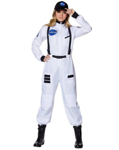 a woman in a white space suit is posing for the camera with her hands on her head