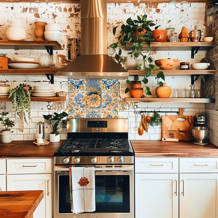 a stove top oven sitting inside of a kitchen next to white cabinets and wooden counter tops