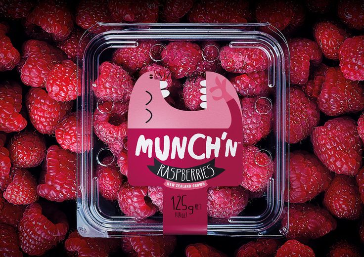 a plastic container filled with raspberries covered in munch'n raspberries