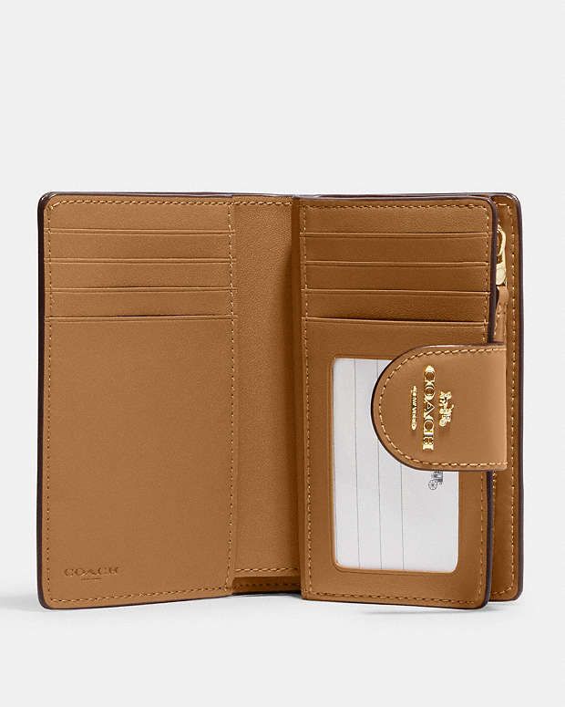 COACH OUTLET® | Medium Corner Zip Wallet In Signature Canvas Coach Outlet, Signature Canvas, Zip Wallet, Zip Pockets, Outlet, Wallet, Architecture, Canvas