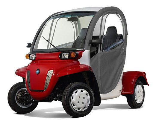 a small red and white golf cart with the door open to show the driver's side view