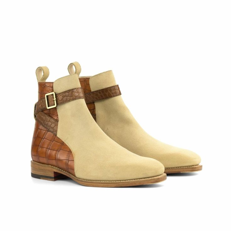 a pair of tan and brown ankle boots