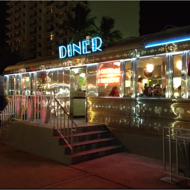 the diner is lit up at night outside