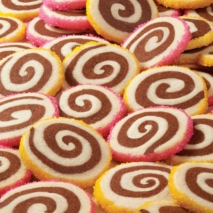 some very pretty looking cookies that are in the shape of spirals and swirls