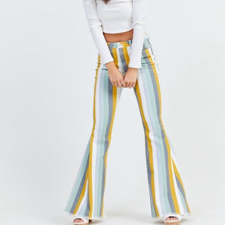 The Electra Flare Jeans Are A Statement Piece This Season! With Exaggerated Flare Detailing And A Destroyed Hem, These Jeans Are Perfect Paired With Your Favorite Sweater Or Graphic Tee! Size: L Fit: High Rise, Fitted Thighs, Flare Bottom Closure: Button And Zipper Front Imported Yellow Jeans For Spring, Trendy Yellow Summer Jeans, Retro Multicolor Spring Jeans, Retro Multicolor Summer Jeans, Multicolor Retro Spring Jeans, Fitted Yellow Jeans For Summer, Summer Striped Fitted Jeans, Striped Denim, Cropped Wide Leg Jeans