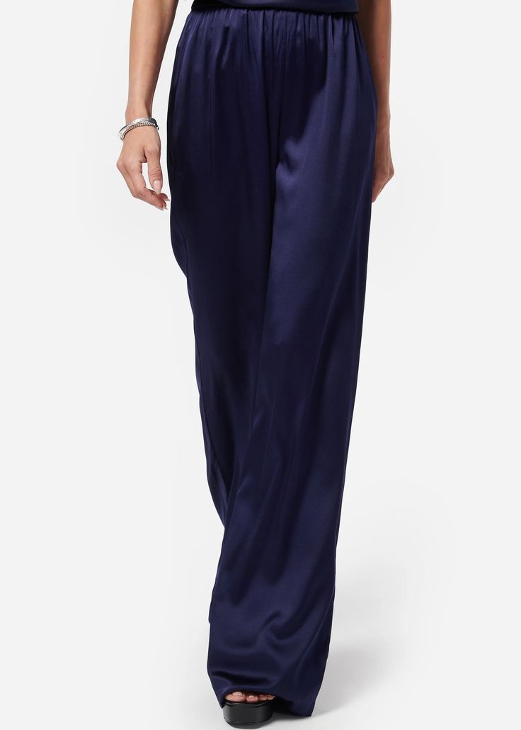 Arcadia Pant in Eclipse Blue from Cami NYC Notes from Cami NYC: The easiest pants you will ever own. The Arcadia Pant is everyone’s new favorite silhouette. These unlined, easy pull-on wide-leg pants feature an elasticated waistband and slash pockets. The perfect pant to take you from day-to-night. FABRIC & CARE • Silk Stretch Sandwash Charmeuse; 92% Silk, 8% Spandex • Dry Clean & Steam Only • Imported SIZE & FIT • True to size • Model wears size XS and is 5'10 Elegant Wide Leg Lounge Pants With Pull-on Style, Elegant Blue Pants With Elastic Waistband, Blue Wide-leg Pull-on Pants, Chic Blue Pants With Elastic Waistband, Blue Wide-leg Pants With Elastic Waistband, Elegant Relaxed Fit Blue Bottoms, Elegant Blue Relaxed Fit Bottoms, Elegant Blue Wide Leg Pants With Elastic Waistband, Elegant Blue Pants For Loungewear