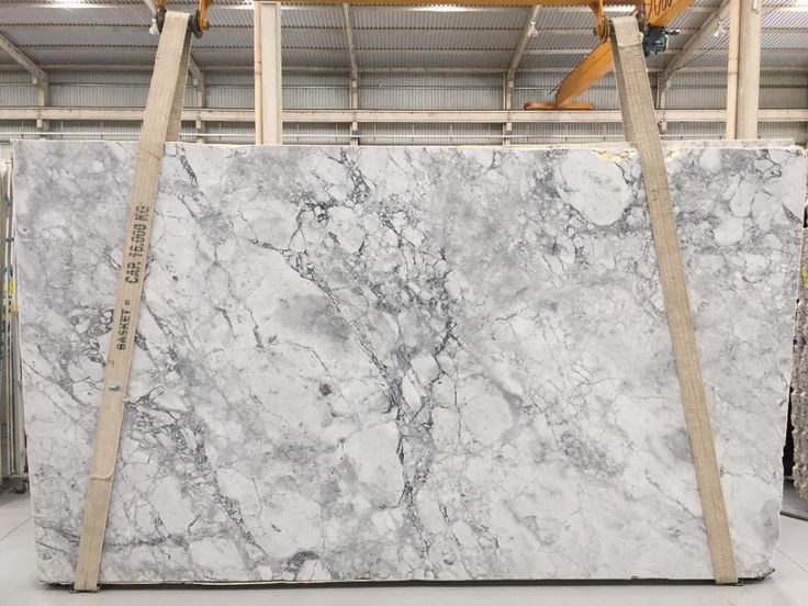 a large white marble slab in a warehouse