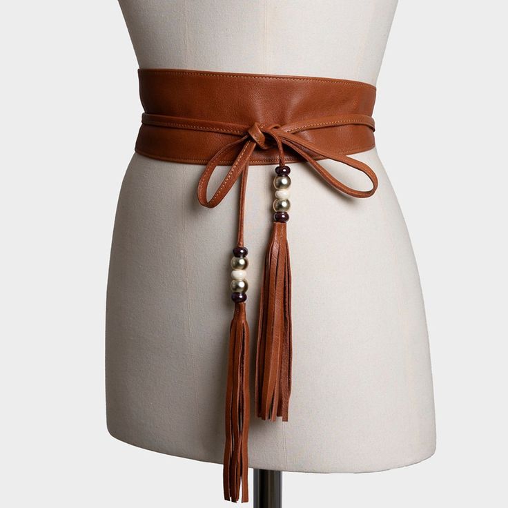 This Brown sash belt is made of smooth and supple lamb leather. It is an elegant women's belt that reinforces its appeal with two tassels at its ends.  Each tassel is decorated with five small crystal balls in gold, brown, and beige metallic colors. A brown belt that combines very well with all kinds of dresses, tunics, blouses, etc. It is usually worn around the waist and tied in the front. This is a handmade product in which we have used the best natural leather. Color and appearance may vary Elegant Adjustable Belts For Fall, Brown Leather Belt For Party, Brown Leather Belts For Party, Brown Leather Party Belts, Leather Obi Belt, April Birthstone Jewelry, Crystal Balls, March Birthstone Jewelry, Obi Belt