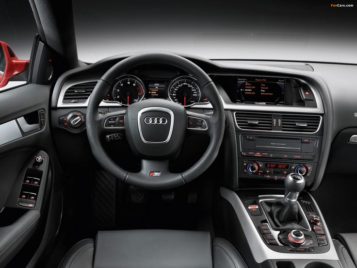 the interior of an audi car is shown in black and grey colors with red trims