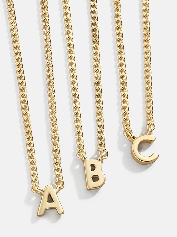 NO WAIT TIME: This product is ready to ship and requires no extra wait time. The perfect solution for when you need the perfect, personalized gift quick (or simply can't wait to get your new piece). An initial necklace is an accessory that everyone needs in their wardrobe. This petite piece features a tiny gold letter Simple Initial Jewelry, Stacking Necklaces Initials, Cheap Initial Necklace, Custom Name Necklace Gold, Personlised Necklace, Silver Meaning, Gold Medallion Necklace, Name Necklace Gold, Gold G