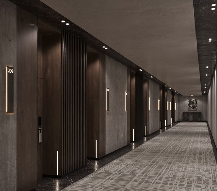 the hallway is lined with wooden doors and lights