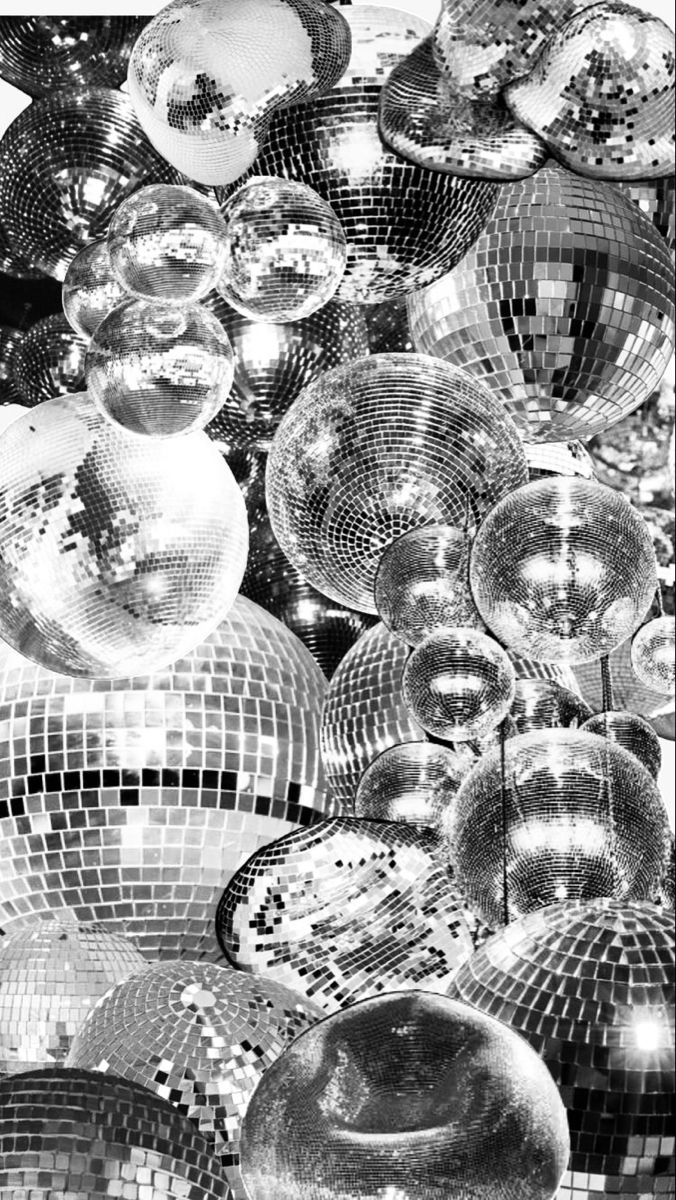 black and white photograph of shiny disco balls