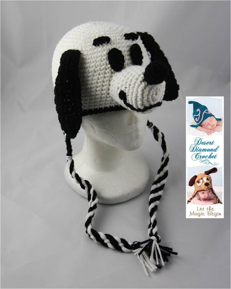 a crocheted dog hat with black and white stripes