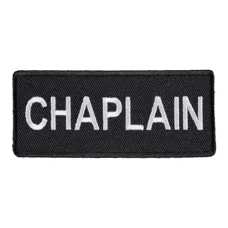 a black and white patch with the word chaplain in white letters, on top of it