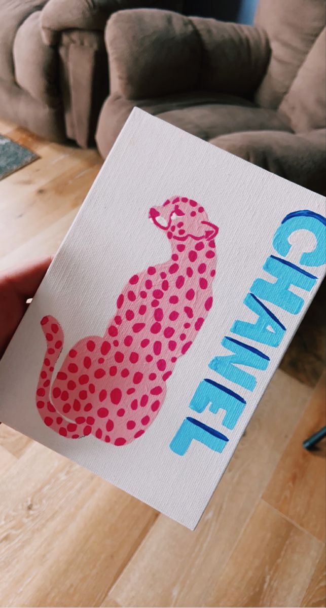 a person holding up a card with the word chillin'in blue and pink