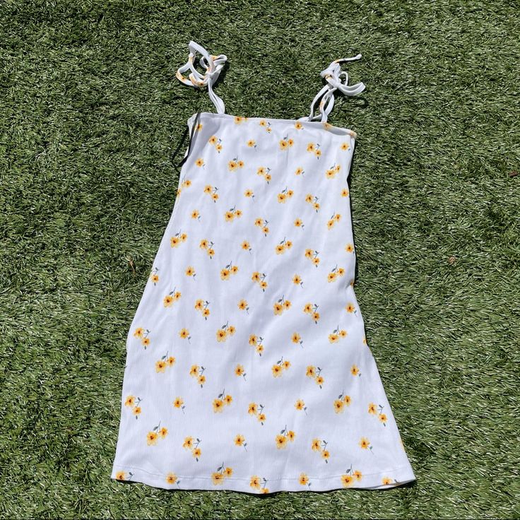 Never Worn White Dress With Yellow Flowers All Over! Size Small! White Mini Floral Dress With Ditsy Print, Spring Daisy Print Mini Dress For Day Out, Spring Mini Dress With Daisy Print For Day Out, White Ditsy Floral Print Dress For Spring, Summer Daisy Print Mini Dress For Day Out, Cute White Sundress For Spring, Summer Daisy Print Mini Dress, White Ditsy Floral Print Sundress For Spring, Spring Daisy Print Mini Dress For Vacation