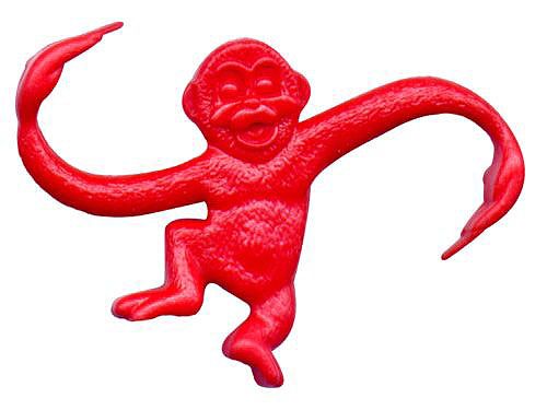 a red monkey figurine is shown on a white background and appears to be in mid air