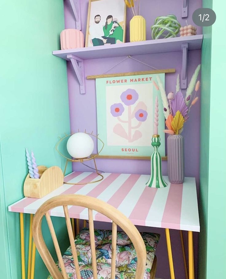 a desk and chair in the corner of a room with purple walls, green flooring and colorful furniture