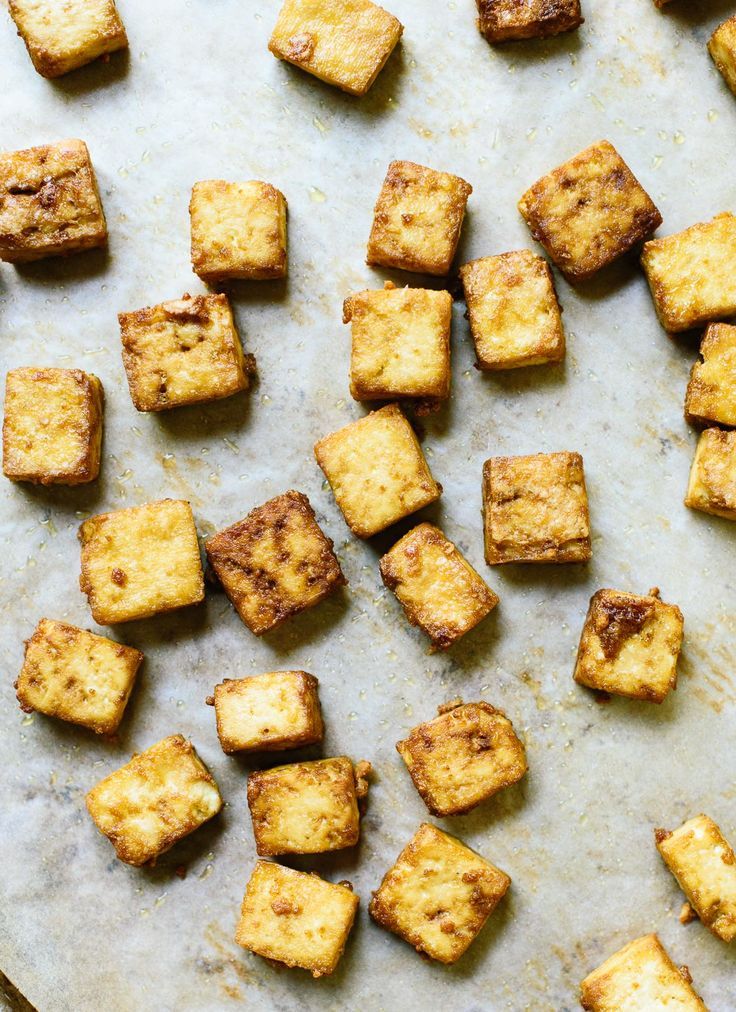 tofu cubes on a baking sheet ready to be cooked