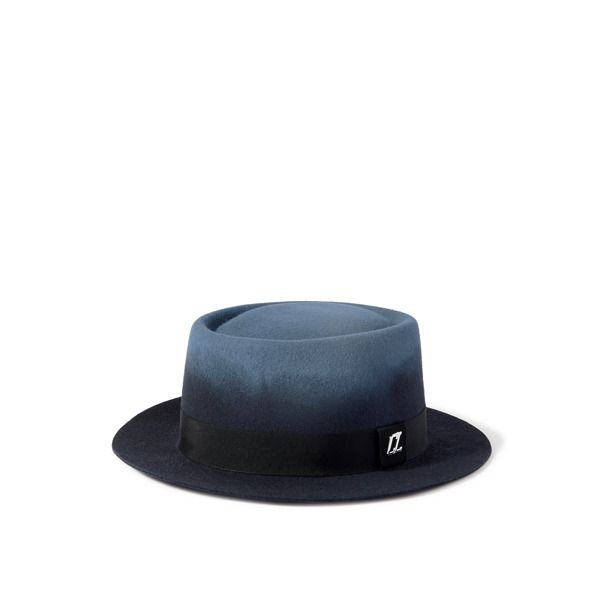 Hats off to Christian Louboutin's 'Andaloubi' fedora. It's made from plush merino wool-felt in a subtle ombré finish and has a wide brim trimmed with grosgrain at the base. The polished 'CL' logo is attached to one side. Winter Wool Top Hat With Flat Brim, Designer Winter Hats With Curved Brim, Luxury Winter Fedora With Short Brim, Luxury Wool Hat For Formal Occasions, Luxury Winter Hats With Short Brim, Luxury Flat Brim Winter Hat, Luxury Wool Hats, Luxury Wool Felt Hat For Winter, Fitted Wool Top Hat With Flat Crown