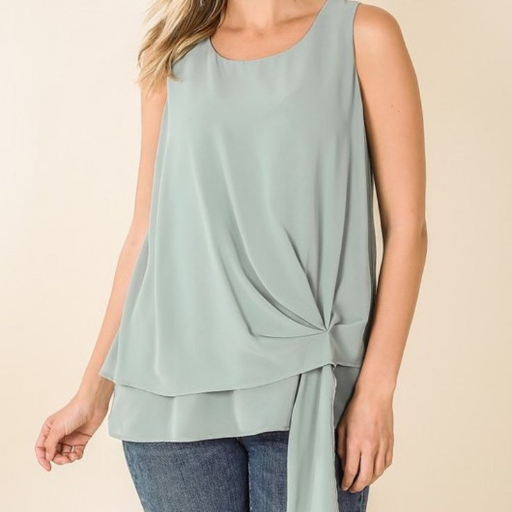 Woven Double Layer Chiffon Sleeveless Side Tie Top - Full Body Double Layered - Best Quality Woven Total Body Length: 22.5"(Front), Bust: 38" Approx. - Measured From Small * Color May Vary Slightly Due To Monitor Resolution Fabric 100% Polyester Made In Imported Style#2361 Casual Chiffon Top For Layering, Flowy Sleeveless Chiffon Top, Flowy Sleeveless Top For Layering, Spring Chiffon Sleeveless Blouse, Elegant Sleeveless Flowy Top, Elegant Flowy Sleeveless Top, Sleeveless Flowy Green Blouse, Flowy Sleeveless Green Blouse, Flowy Green Sleeveless Blouse