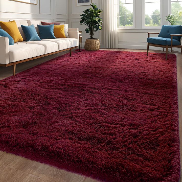 a living room with a red rug on the floor